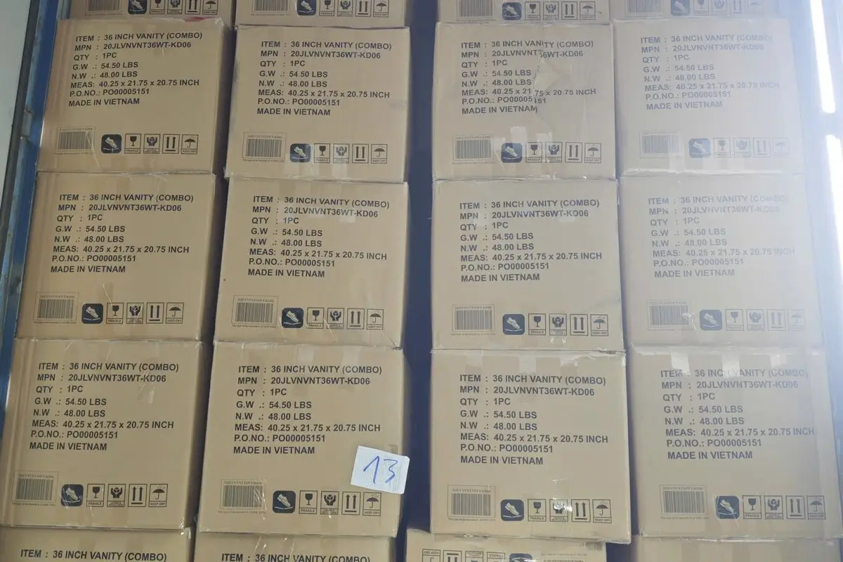 KD flat-pack bathroom vanity boxes stacked floor-to-ceiling in 40HC container — maximized loading efficiency